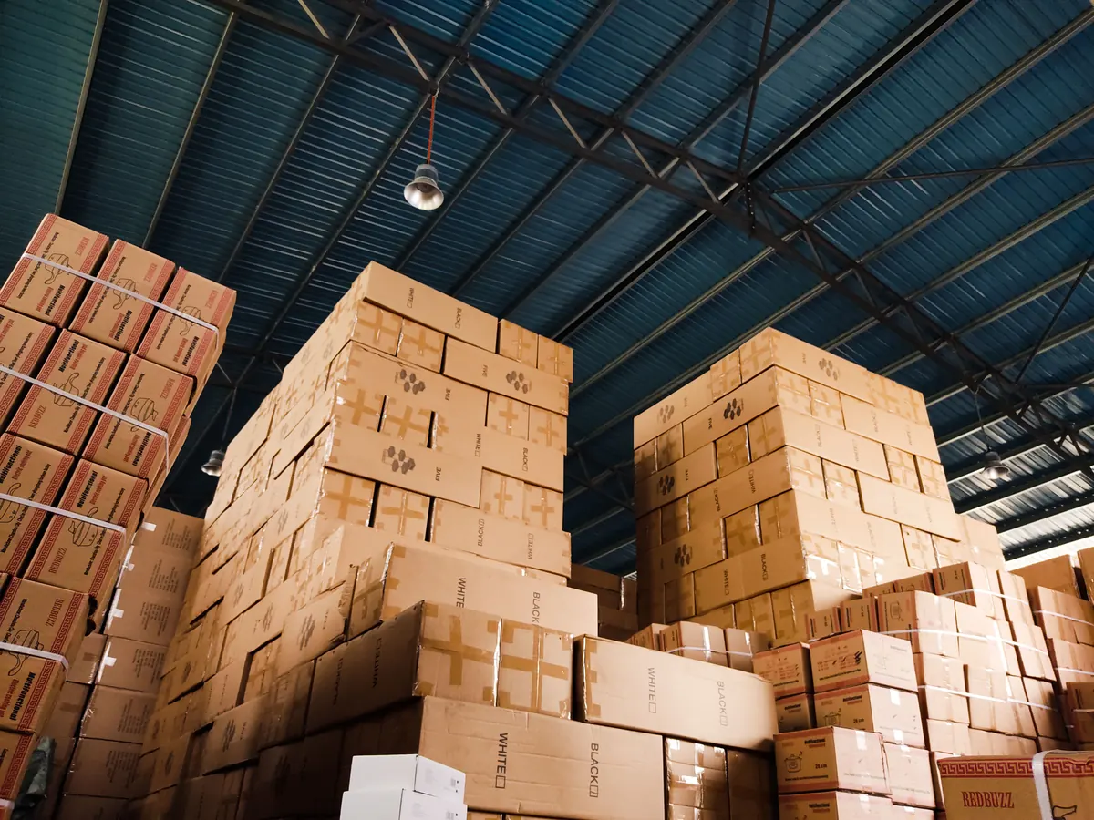 Warehouse with stacked cartons ready for order handling