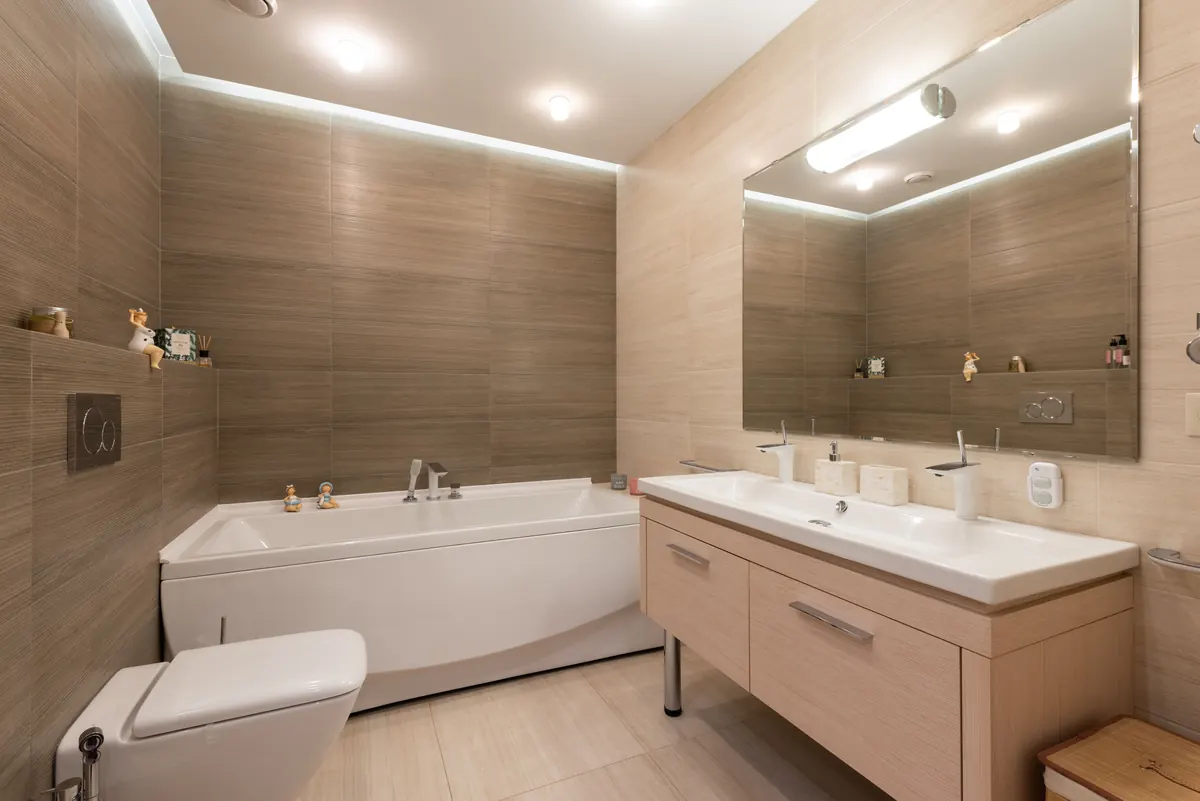 Finished hospitality bathroom with basin, bath, and fittings