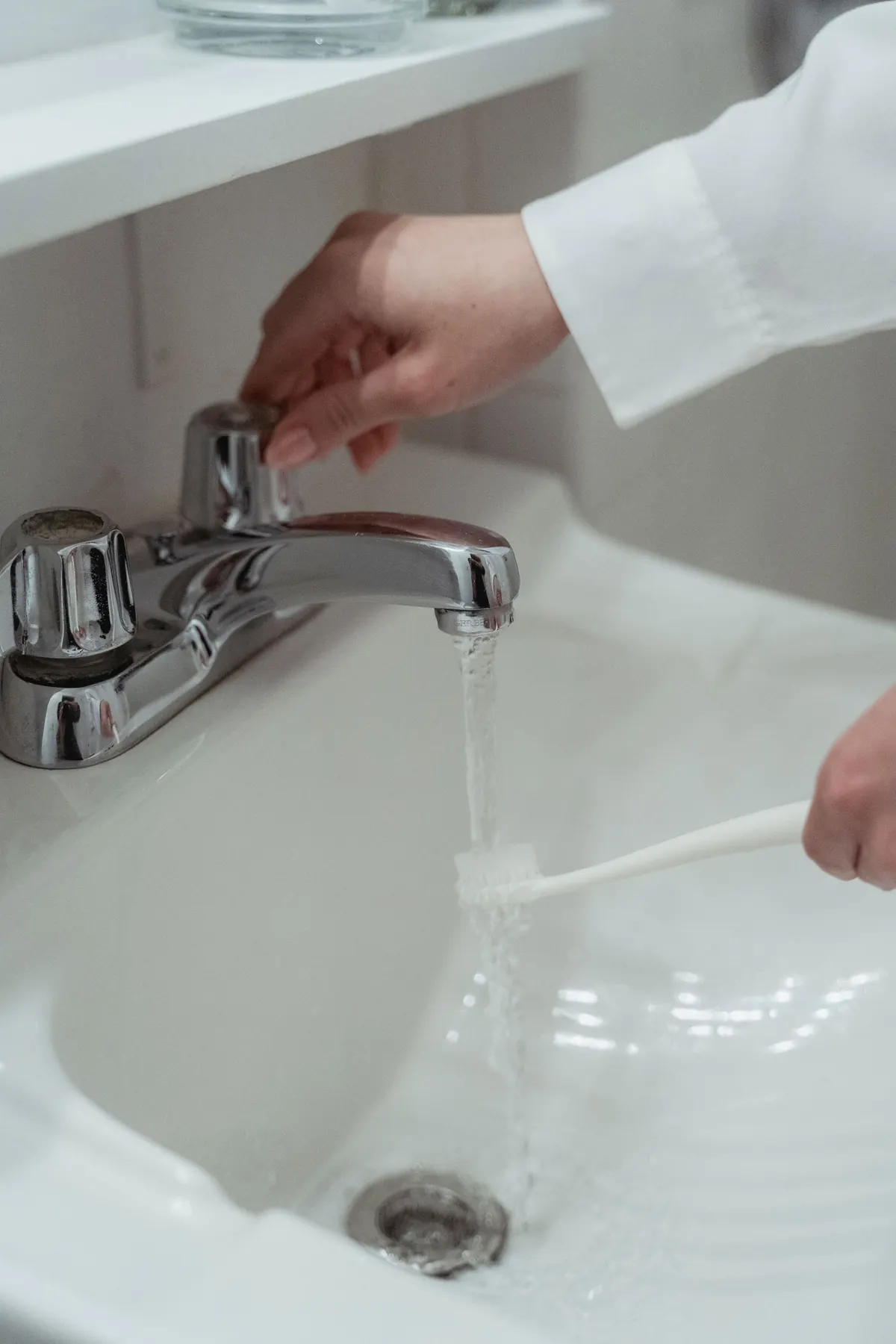 Hand checking a faucet and drain assembly