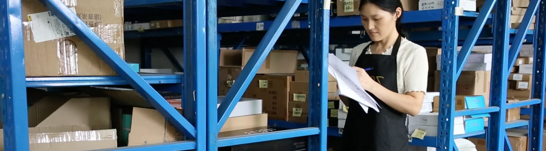 VeriBath warehouse staff checking a bathroom hardware project order picking list