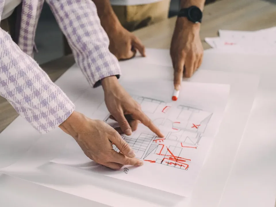 Marked-up building plan under item-by-item review